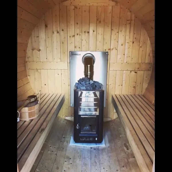 The sauna at Armonia, timber benches under a pine ceiling.
